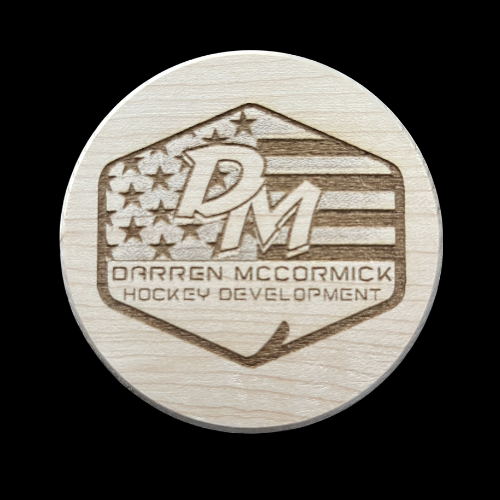 DM Hockey Development Puck with players last name and jersey number on the back